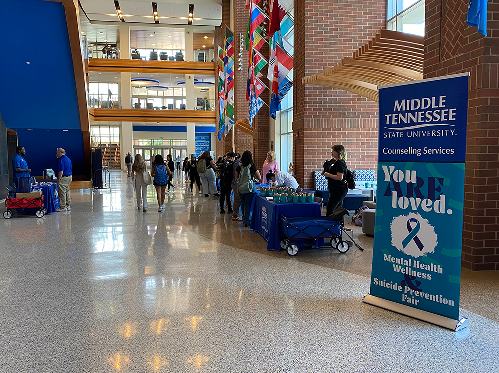 Photo of Suicide Prevention Fair with banner prominently displayed