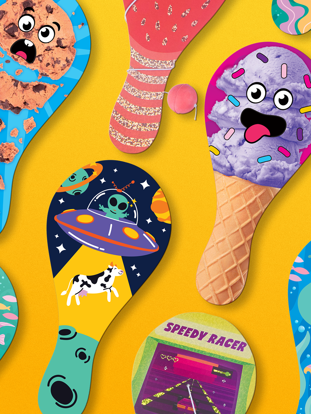 Multiple paddle ball designs laid out on a surface